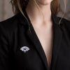 Portrait of a beautiful girl with hairstyle and make-up in a black jacket.
