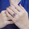 Cushion Blue Topaz Ruby and Diamond Engagement Ring on Body Front Distant blue topaz ruby and diamond ring 14k gold on body distant