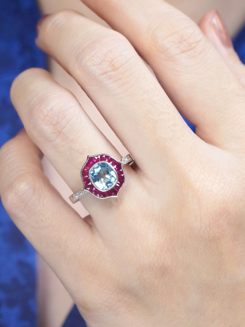 Cushion Blue Topaz Ruby and Diamond Engagement Ring on Body Front Near blue topaz ruby and diamond ring 14k gold on body front near