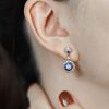 diamond-sapphire-drop-earrings-on-body-distant-front Diamond and Sapphire Drop Earrings Front Distant