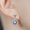 diamond-sapphire-drop-earrings-on-body-near-front Diamond and Sapphire Drop Earrings Front Near