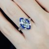 marquise-aquamarine-and-sapphire-engagement-ring-on-body-front-near Marquise Aquamarine Sapphire and Diamond Engagement Ring on Body Near