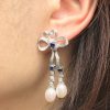 pearl-drop-earrings-on-body-near-front Pearl Sapphire and Diamond Drop Earrings Edwardian Style On Body