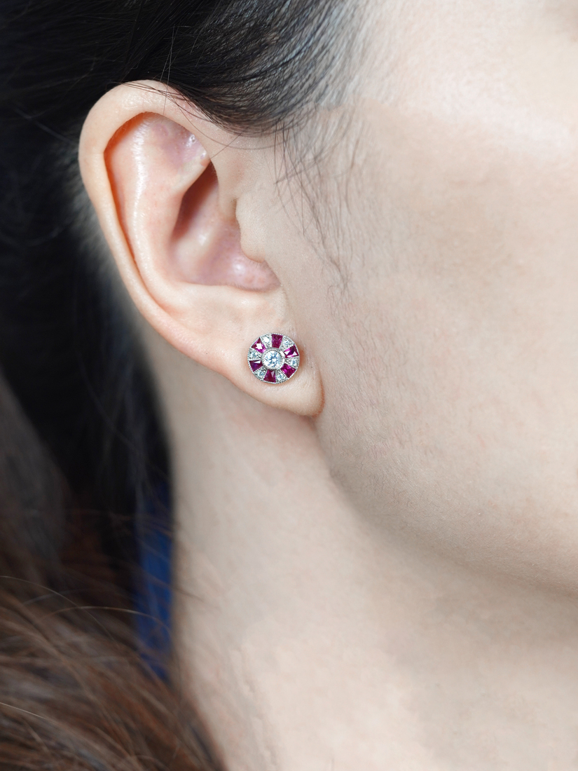 Round Diamond and Ruby Stud Earrings on Body Front Distant round diamond ruby stud earrings 14k gold front distant