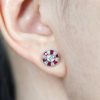 Round Diamond and Ruby Stud Earrings on Body Near round diamond ruby stud earrings 14k gold on body front near