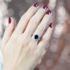 sapphire-and-diamond-engagement-ring-on-body-distant-front Sapphire and Diamond Engagement Ring on Body Distant Front
