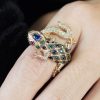 Sapphire Emerald Ruby and Diamond Statement Ring on Body Front Near sapphire ruby emerald diamond statement ring 14k gold on body front near