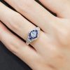 aquamarine-sapphire-diamond-engagement-ring-14k-white-gold-on-body-front-near Aquamarine and Blue Sapphire Engagement Ring on Body Front Near