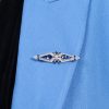 blue-sapphire-and-diamond-geomatric-art-deco-style-brooch-14k-gold-on-body-near Blue Sapphire and Diamond Brooch on Body Near