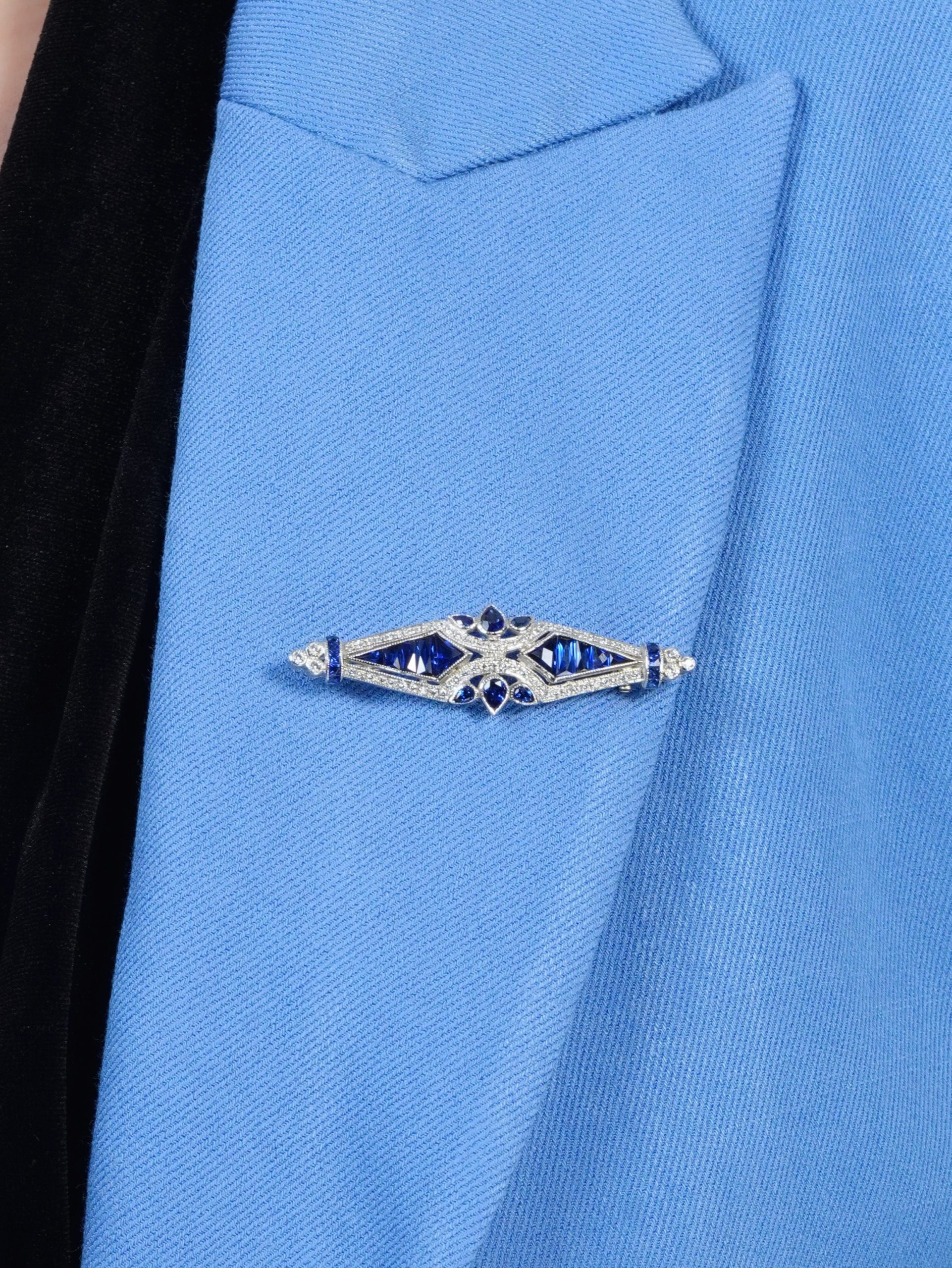 blue-sapphire-and-diamond-geomatric-art-deco-style-brooch-14k-gold-on-body-near Blue Sapphire and Diamond Brooch on Body Near