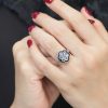 diamond-cluster-blue-sapphire-ring-art-deco-18k-white-gold-on-body-front-near Diamond Cluster and Blue Sapphire Art Deco Style Ring