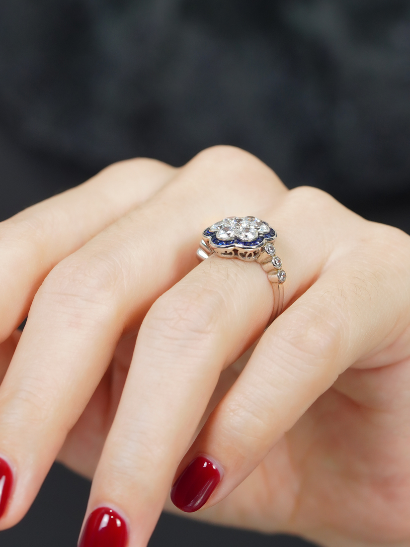 diamond-cluster-blue-sapphire-ring-art-deco-18k-white-gold-on-body-side-near Diamond Cluster and Blue Sapphire Art Deco Style Ring