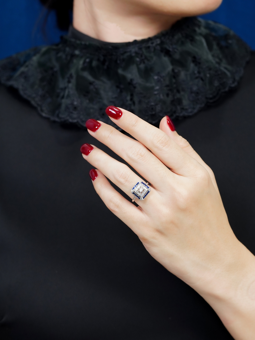 diamond-sapphire-halo-ring-art-deco-style-14k-white-gold-on-body-front-distant' Diamond and Sapphire Art Deco Style Halo Ring on Body Front Distant