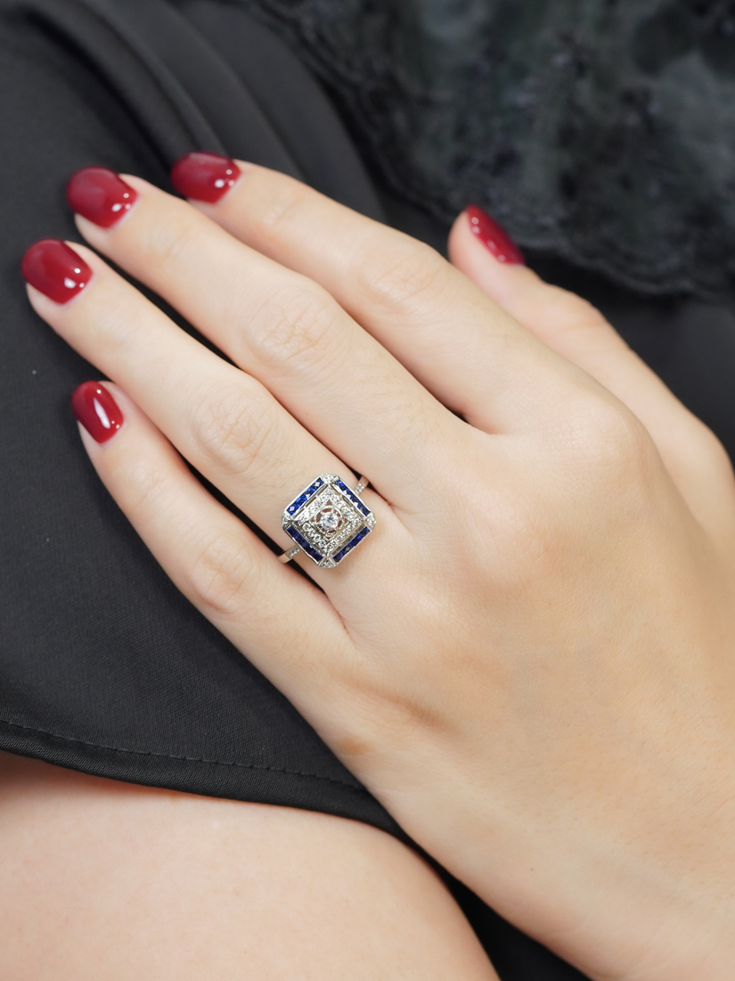 diamond-sapphire-halo-ring-art-deco-style-14k-white-gold-on-body-front-near Diamond and Sapphire Art Deco Style Halo Ring on Body Front Near