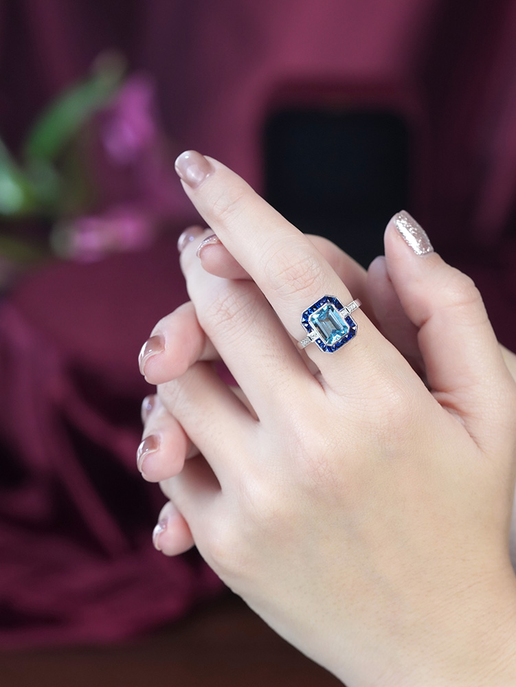 Emerald Cut Blue Topaz Art Deco Style Ring on Body Distant