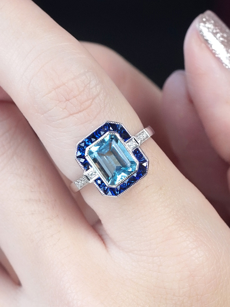 Emerald Cut Blue Topaz Art Deco Style Ring on Body Near