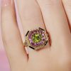 octagonal-peridot-pink-sapphire-diamond-ring-art-deco-style-18k-gold-on-body-front-near Peridot Pink Sapphire Art Deco Style Ring on Body Front Near