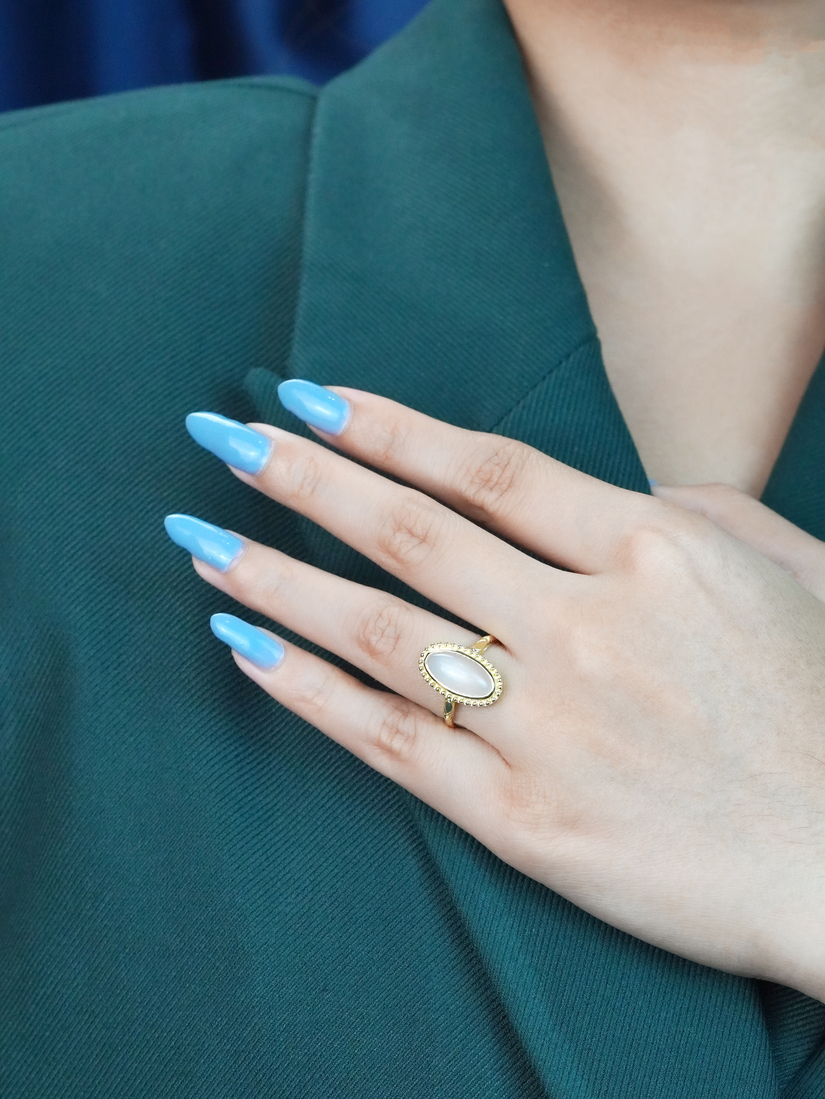 oval-moonstone-solitaire-ring-art-deco-style-9k-gold-on-body-front-distant Oval Moonstone Art Deco Style Ring on Body Front Distant