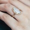 oval-moonstone-solitaire-ring-art-deco-style-9k-gold-on-body-front-near Oval Moonstone Art Deco Style Ring on Body Front Near
