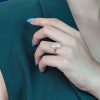 oval-moonstone-solitaire-ring-art-deco-style-9k-gold-on-body-side-distant Oval Moonstone Art Deco Style Ring on Body Side Distant