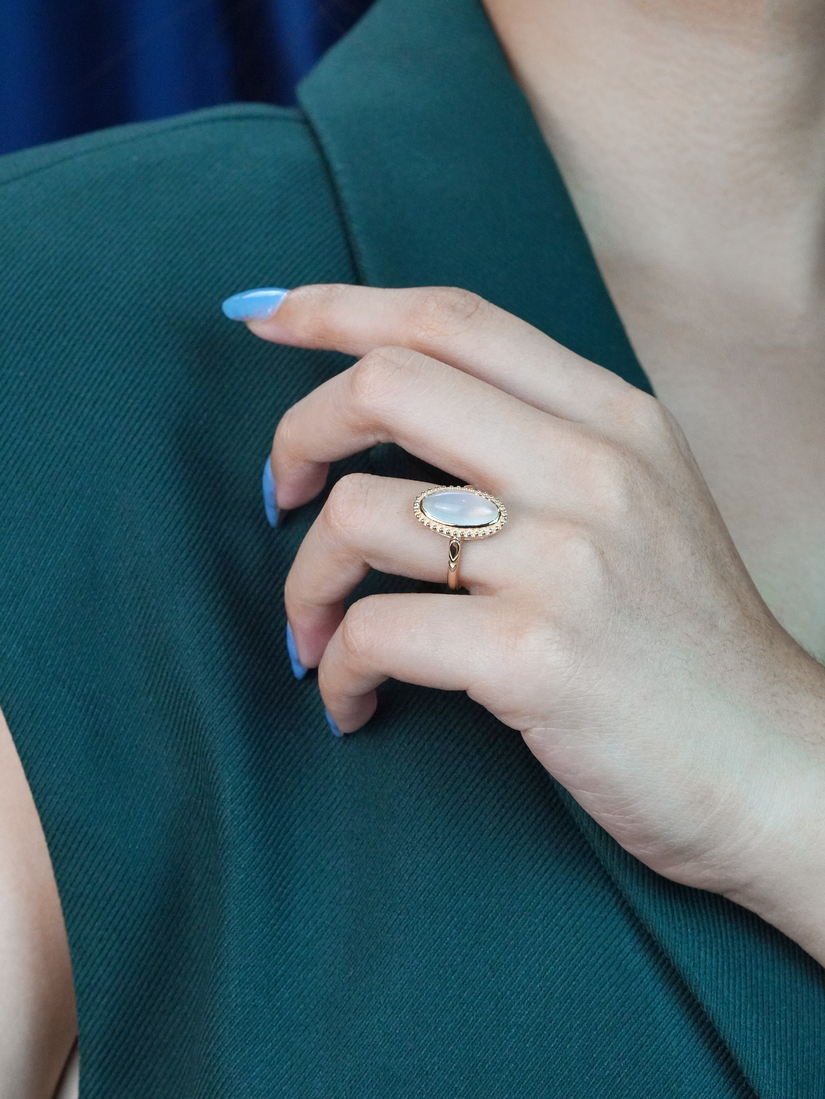 oval-moonstone-solitaire-ring-art-deco-style-9k-gold-on-body-side-distant Oval Moonstone Art Deco Style Ring on Body Side Distant