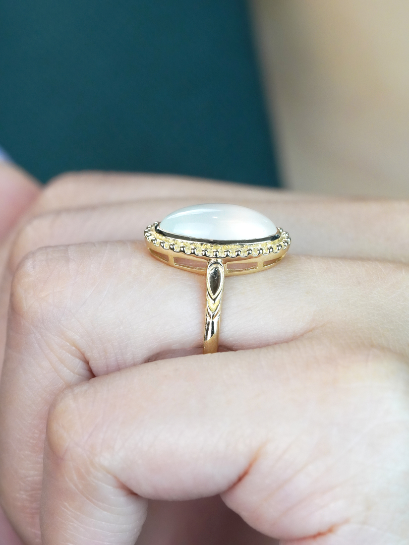 oval-moonstone-solitaire-ring-art-deco-style-9k-gold-on-body-side-near Oval Moonstone Art Deco Style Ring on Body Side Near