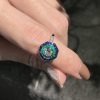 round-diamond-emerald-sapphire-target-ring-art-deco-style-18k-gold-beauty-shot-front Diamond Emerald Sapphire Art Deco Style Ring on Body Near