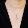 round-opal-emerald-diamond-necklace-art-deco-style-14k-gold-on-body-front-distant Opal Emerald Art Deco Style Necklace on Body Front Distant